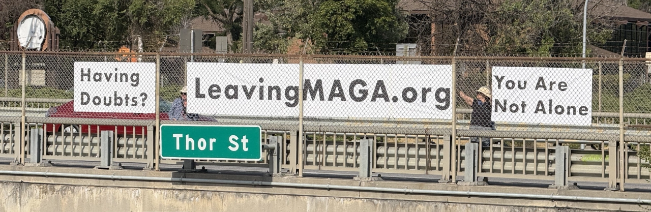 Overpass Banner lg. webp Volunteers display banners reading “Having Doubts?”, “LeavingMAGA.org,” and “You Are Not Alone” on the Thor Street bridge.